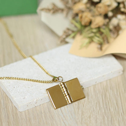 Custom Golden Book Locket – Name or Message Engraved A tiny book that holds a lifetime of love.